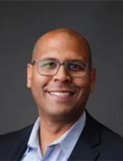 Headshot of Dr. Alex Dummett